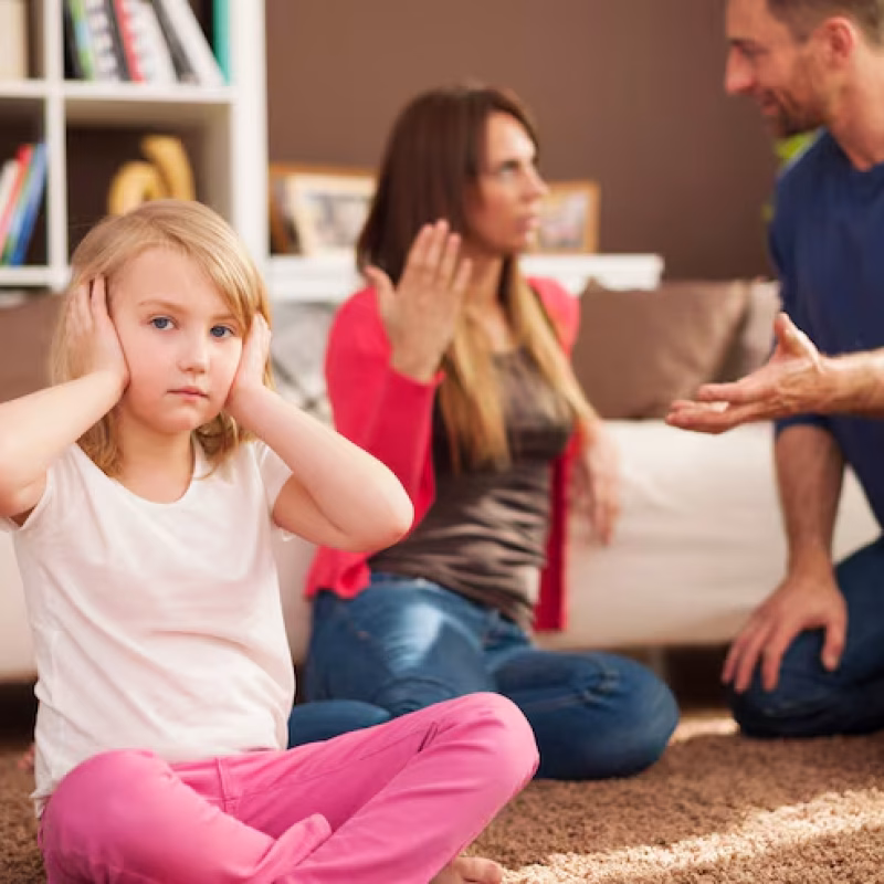 little-girl-doesn-t-want-hear-arguing-parents_329181-2686